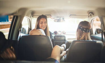 Three woman get ready for a spring road trip in Georgia.
