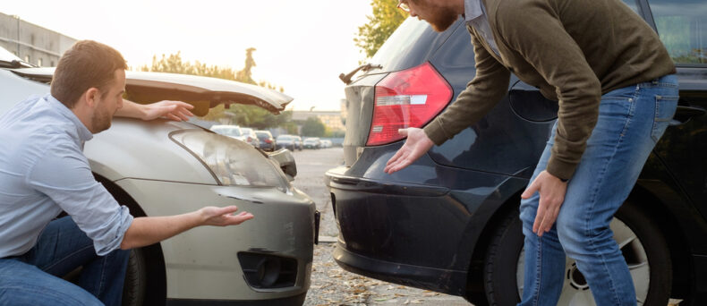 people standing near car collision