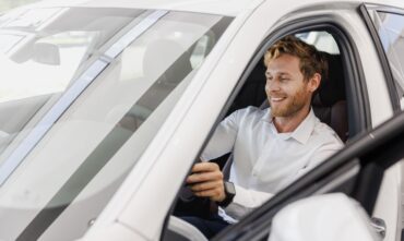 Satisfied smiling man customer buying his new car- Southern Harvest Cheap homeowners in Georgia.