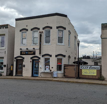 Historic downtown storefronts with small local shops along a street in Acworth, Georgia