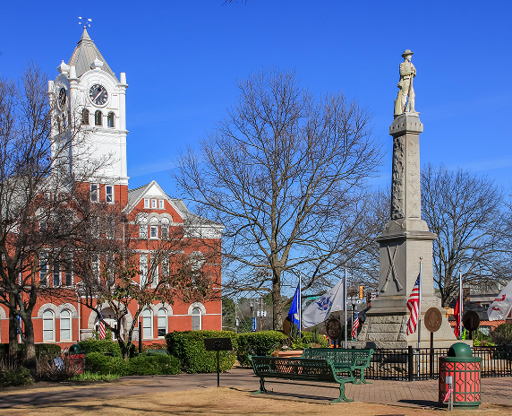 McDonough, GA / USA - January 11, 2019: A view of the statue of a Confederate States solider in front of the Henry County Courthouse.